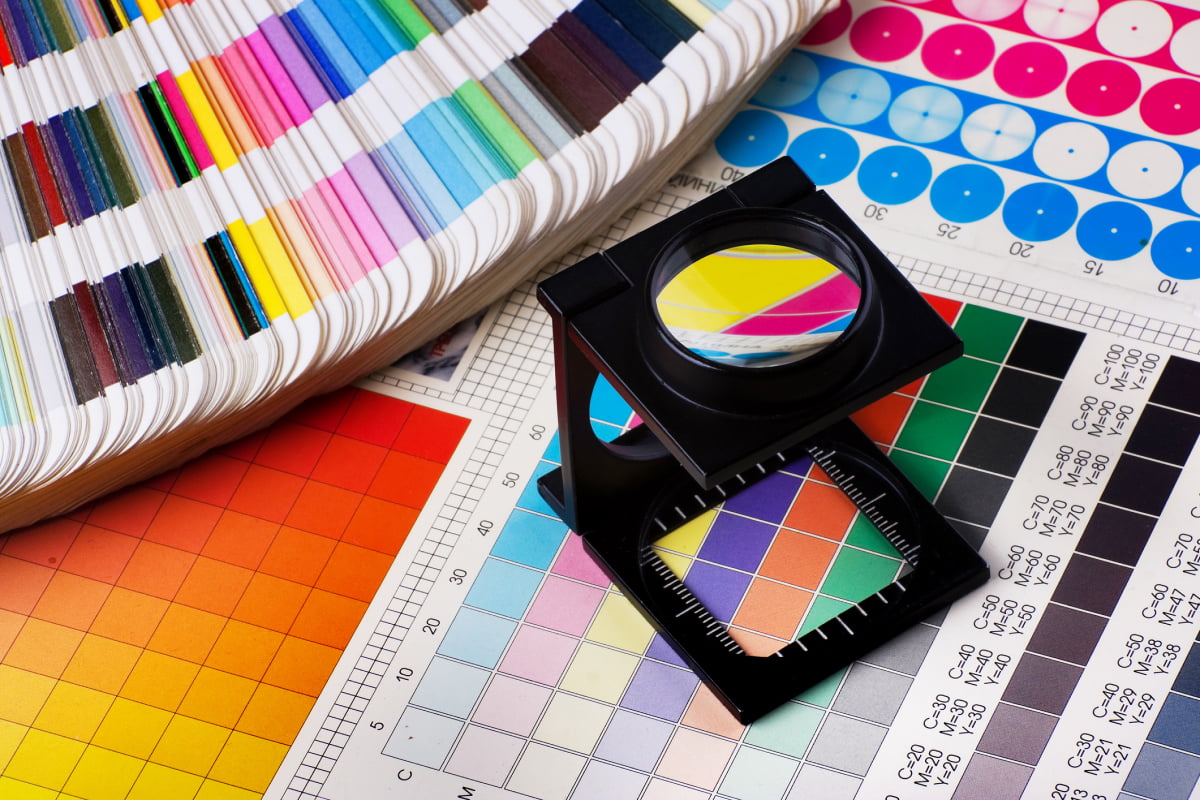 Color swatches and magnifying glass on a desk